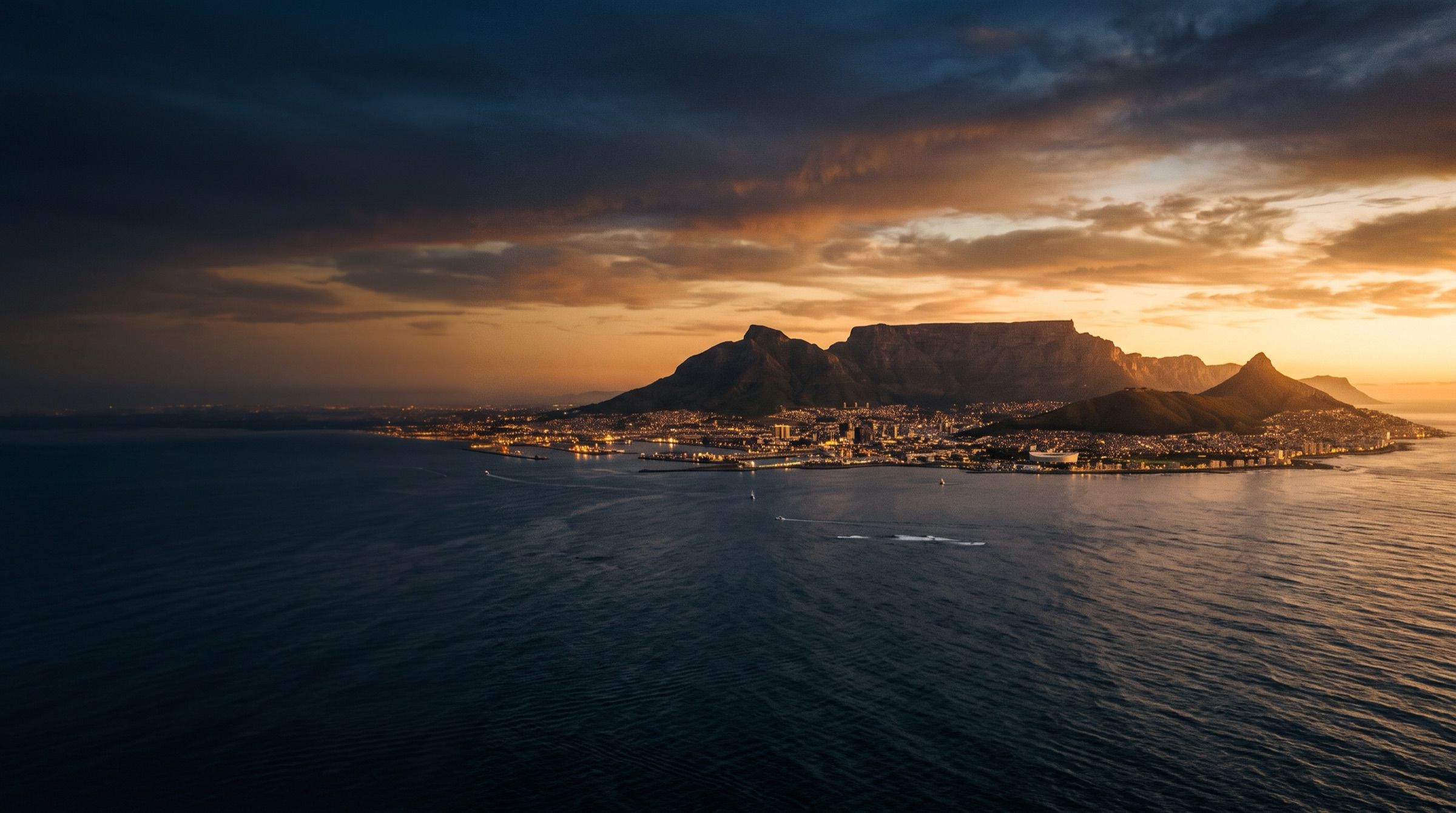 Table Mountain and Cape Town at sunset seen from across the bay